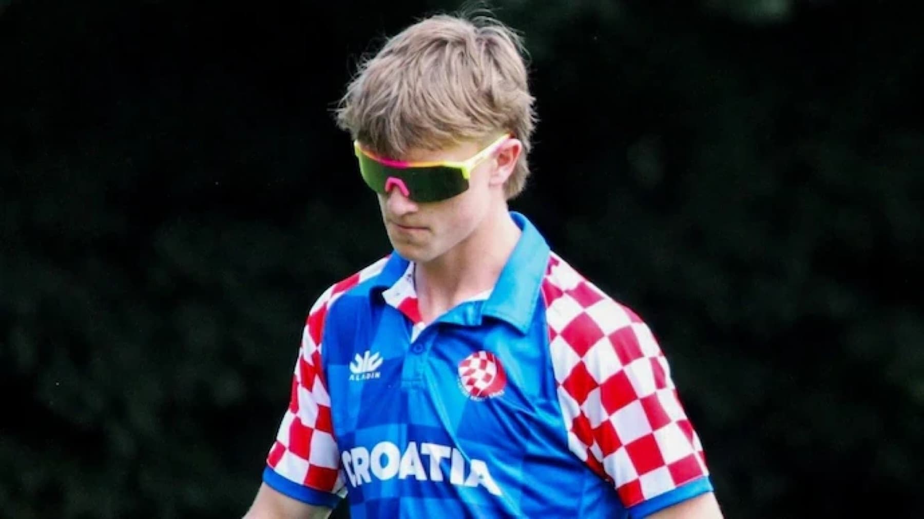Croatia's Zach Vukusic in chequered red and white kit